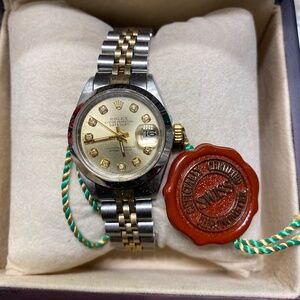 Rolex Women’s Gold and Silver Watch